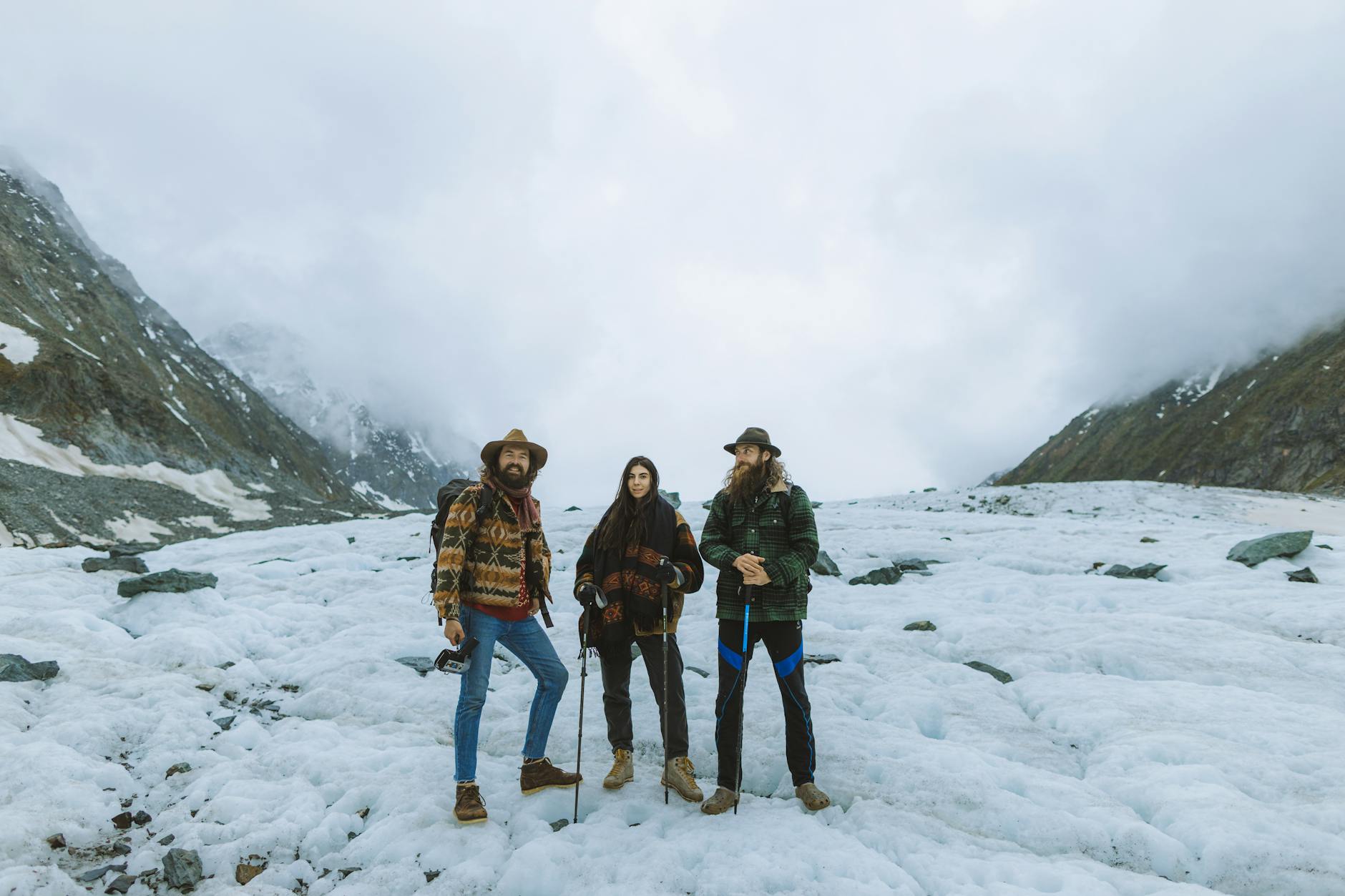 three people on the snowy mountain
